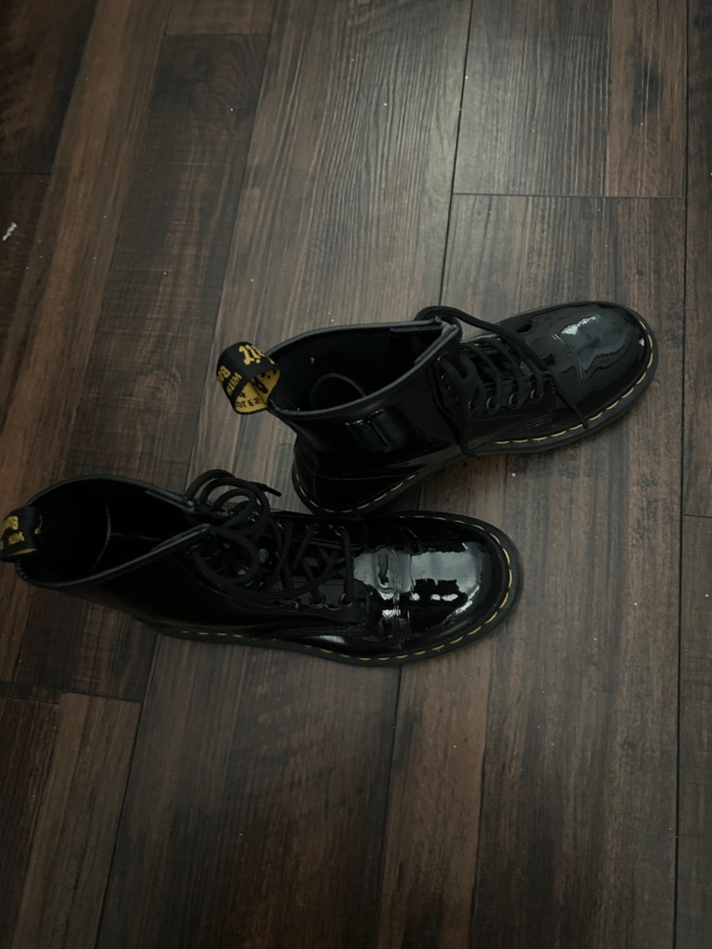 Dr. Martens Black Patent Leather Lace-Up Boots with Yellow Stitching